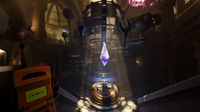 A walkie-talkie beside a suspended crystal mechanism